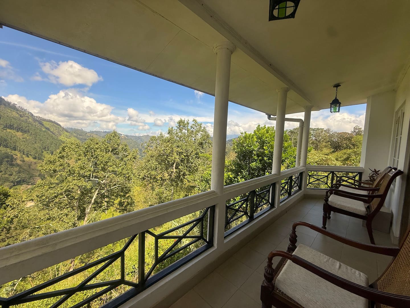 Covered balcony with chairs overlooking the mountains