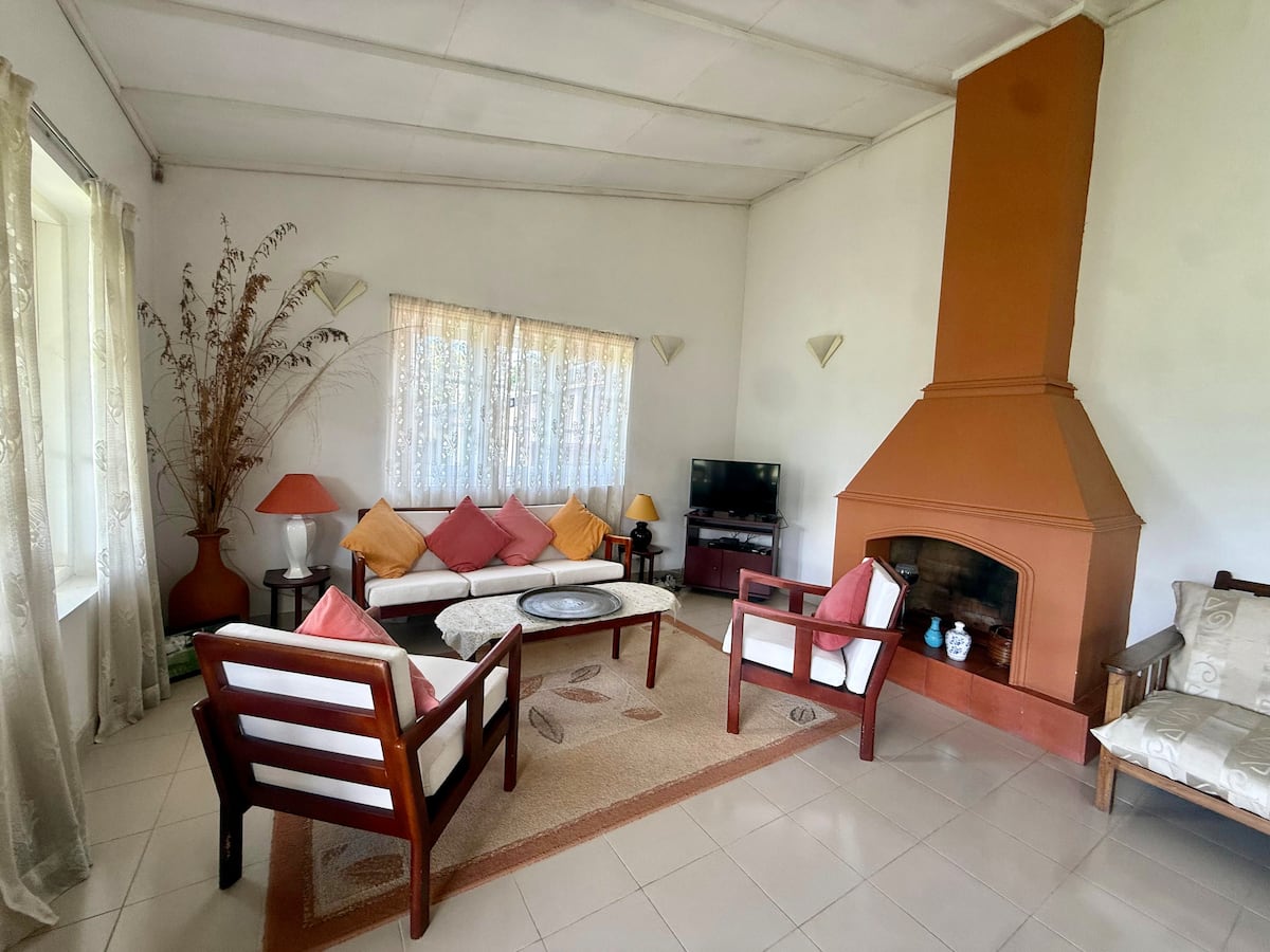 Lounge and fireplace at Villa Krista, Ella