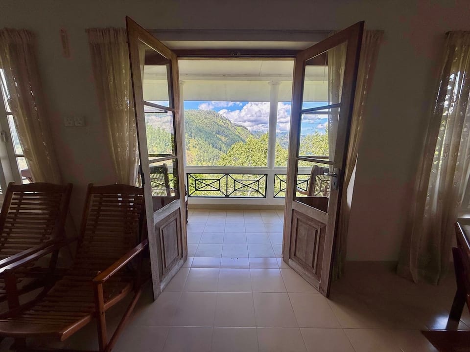 Living room doors opening to the hills at Villa Krista, Ella